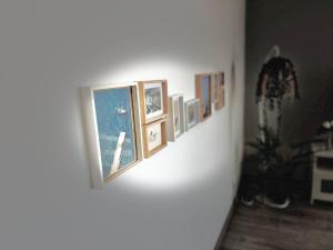 a group of pictures on a wall in a room at Rocha Atlantico in Portimão