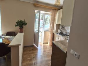 a kitchen with a counter and a table in a room at Apartment in Jermuk in Jermuk