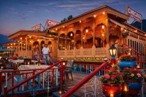 a train restaurant on a pier at night at Chicago Group of Houseboats in Srinagar