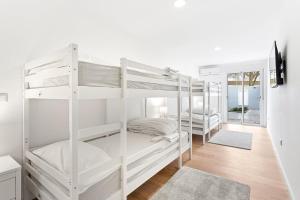 a bedroom with two bunk beds and a hallway at A unique experience in Porto in Porto