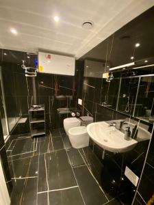 a bathroom with a toilet and a sink at ANTONELLA's ROOM in Bresso +15 photos