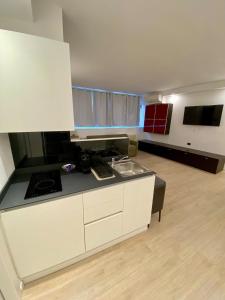 a kitchen with a sink and a counter top at ANTONELLA's ROOM in Bresso