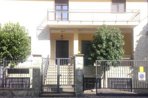 a house with a gate in front of it at ANTONELLA's ROOM in Bresso