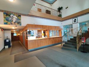 an empty lobby of a building with a staircase at Empire Inn in Brandon