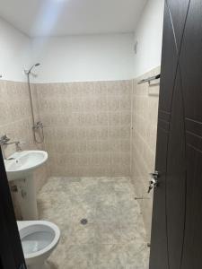 a bathroom with a sink and a toilet at Kennedy House in Lyetnitsa