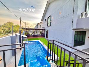 a swimming pool on the balcony of a house at MaaiVilla 22Pax4B4B PrivatePool Pooltable BBQ in Gua Sai