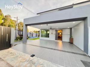 a large white house with a driveway at MaaiVilla 22Pax4B4B PrivatePool Pooltable BBQ in Gua Sai