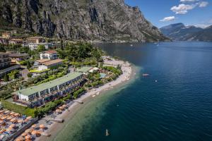 an aerial view of a resort on a beach at Hotel Lido Lakefront in Limone sul Garda +18 photos
