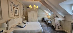 a bedroom with a large bed and a staircase at Les Jardins d'Anaïs in Luxembourg +72 photos