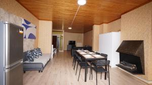 a dining room with a table and chairs and a fireplace at Plantin Apartment in Antwerp +7 photos