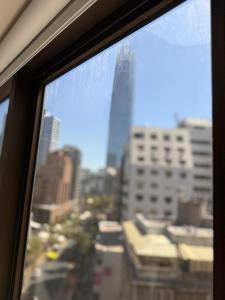 a view of a city skyline from a window at RQ Costanera Apartments in Santiago