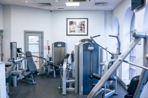 a gym with several treadms and cardio machines at Crowne Plaza Solihull by IHG in Solihull