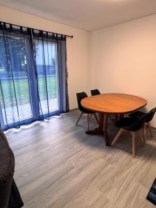 a conference room with a table and chairs and windows at Appartamento CHAN in Cama +45 photos