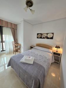 a bedroom with a bed with a tray on it at Hostal Restaurante Piedra in Limpias