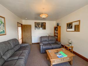 a living room with a couch and two chairs and a table at Uk47551 - Cree View Cottage in Newton Stewart