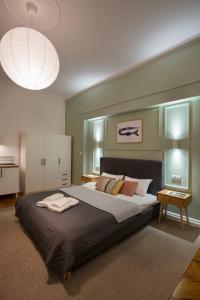 a bedroom with a large bed in a room at High Note Suites in Belgrade