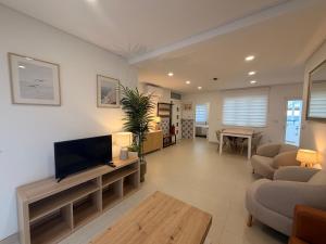 a large living room with a flat screen tv at Dianamar in Albufeira
