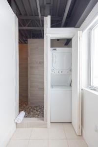 a laundry room with a washer and dryer at Bozeman Basecamp in Bozeman