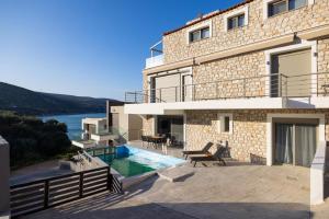 a villa with a swimming pool and a house at Villa Nazar in Xiropigado