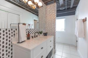 a bathroom with a sink and a large mirror at Bozeman Basecamp in Bozeman +13 photos