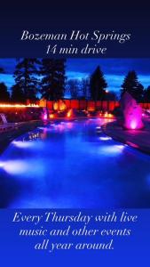 a picture of a swimming pool at night at Bozeman Basecamp in Bozeman