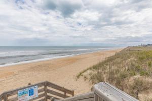 a view of the beach from a boardwalk at 4208 - Naan Sands in Duck