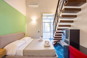 a bedroom with a bed and a staircase at Waterfront Riviera in Naples +116 photos