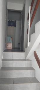 a staircase leading to a bedroom with a bed in it at Appartement les saladelles in Le Grau-du-Roi