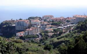 a view of a town on a hill at Madeira Home Holidays in Caniço