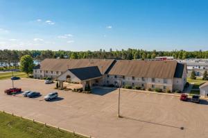 an aerial view of a building with a parking lot at All Seasons Resort in Kalkaska