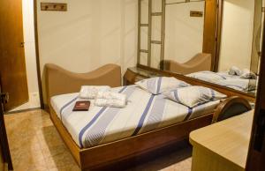 Postel nebo postele na pokoji v ubytování Hotel Ordenes (Adult Only)