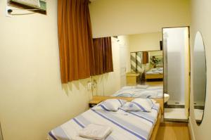 Giường trong phòng chung tại Hotel Ordenes (Adult Only)