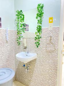 a bathroom with a sink and a toilet at ZK Homestay in Puerto Princesa City +17 photos