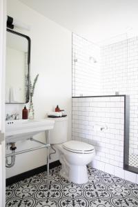a white bathroom with a toilet and a sink at Cuyama Buckhorn in New Cuyama +37 photos