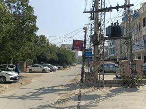 a street with cars parked on the side of the road at Palace inn Hotel in Dargai