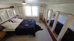 a bedroom with two bunk beds and a window at The Sheep Inn B&B in Arvika