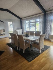a dining room with a table and chairs at Ferienhaus im Eggetal in Preußisch Oldendorf +18 photos
