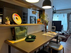 a room with a table with a hat on it at Valley 3F - Mid Century Modern Kawaramachi Apt in Takamatsu