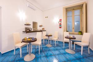 a dining room with two tables and chairs at Waterfront Riviera in Naples