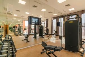 a gym with a lot of equipment in a room at Hampton By Hilton Ben Guerir in Benguerir