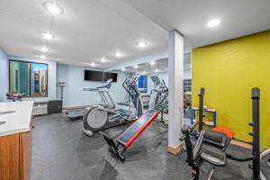a gym with treadmills and elliptical machines at Sonesta Select Hotels Statesville in Statesville