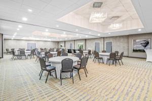 a large room with tables and chairs in it at Sonesta Select Hotels Statesville in Statesville +35 photos