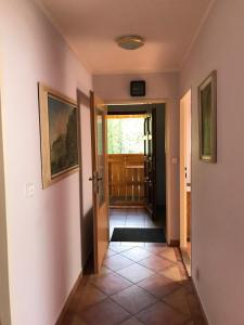 a hallway with a door leading into a room at Forest Paradise in Stružná