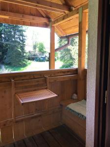 an inside view of a wooden cabin with a window at Forest Paradise in Stružná