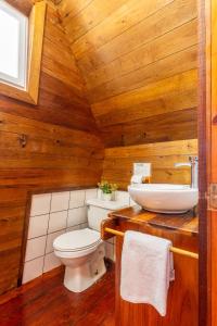 a bathroom with a toilet and a sink at Faro del Colibri in Bocas Town +40 photos
