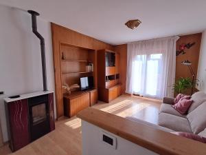 a living room with a couch and a fireplace at Casa Nonna Adelaide in Roncone