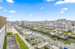 a view of a marina with houses and boats at 2 Bedroom Bayside Condo with Pool in OCMD in Ocean City