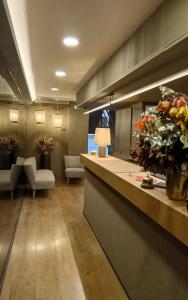 a lobby with a reception counter and a living room at Senator Barcelona Apartments in Barcelona