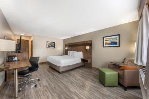 a hotel room with a bed and a desk at Best Western Dos Rios in Junction +30 photos