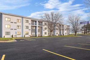 an empty parking lot in front of a building at Spark by Hilton Bettendorf Quad Cities in Bettendorf